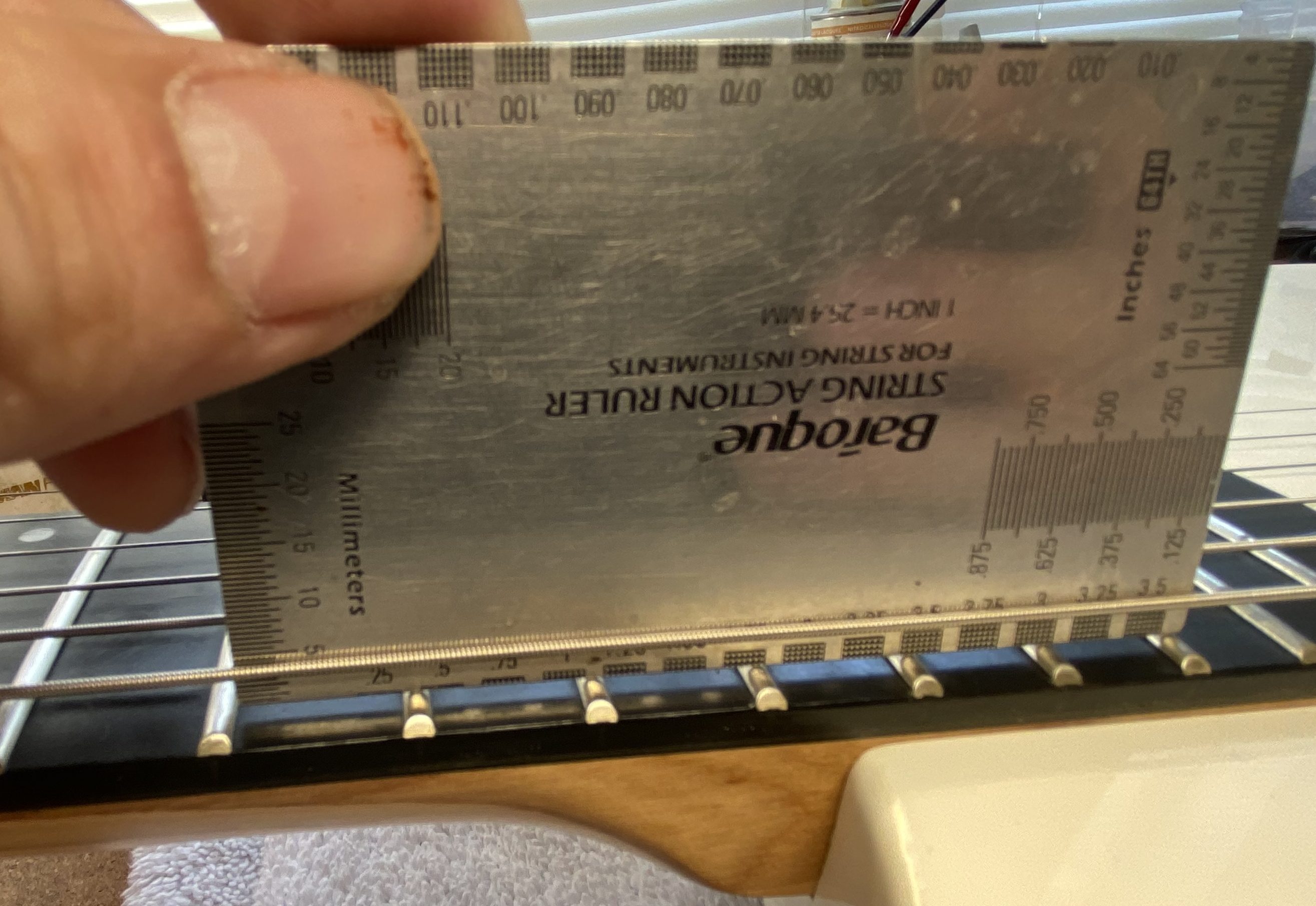 Measuring string action at the 17th fret of an electric guitar